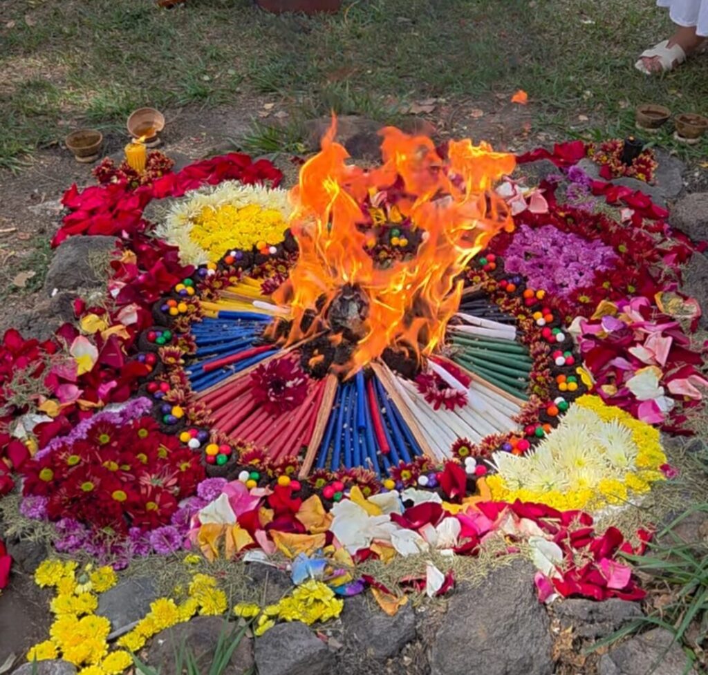 Mayan sacred fire ceremony with flower offerings